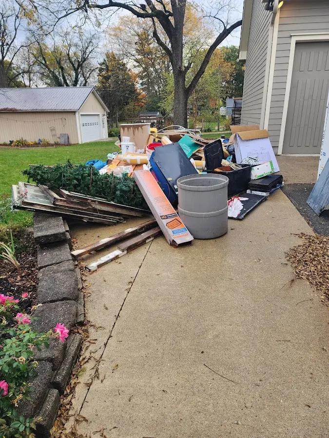 Dumpster being loaded with debris for 3 Yard Dumpster Rental in Thetford